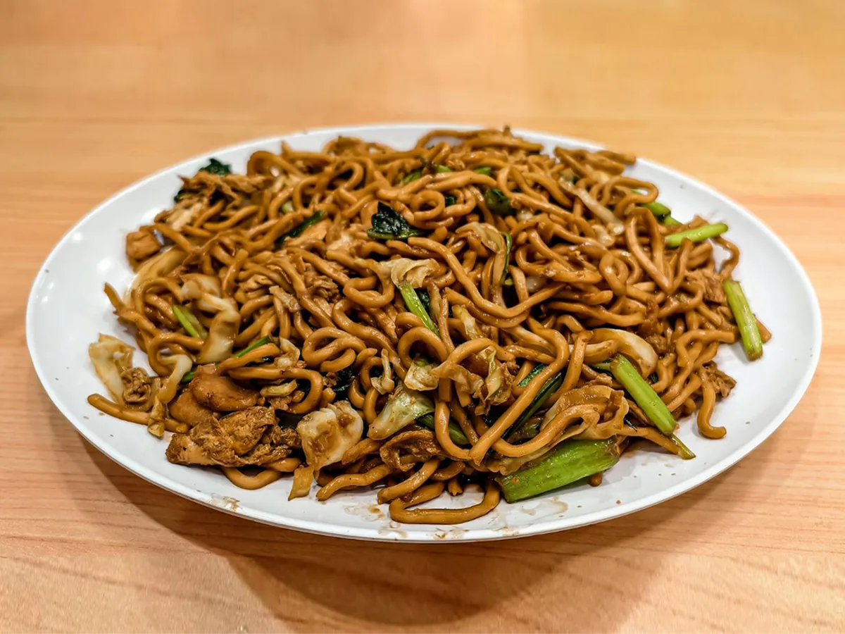 Soft noodles stir-fried with chicken, cabbage & scallions at Dong bei Ren jia, a Asian Restaurant in Chicago