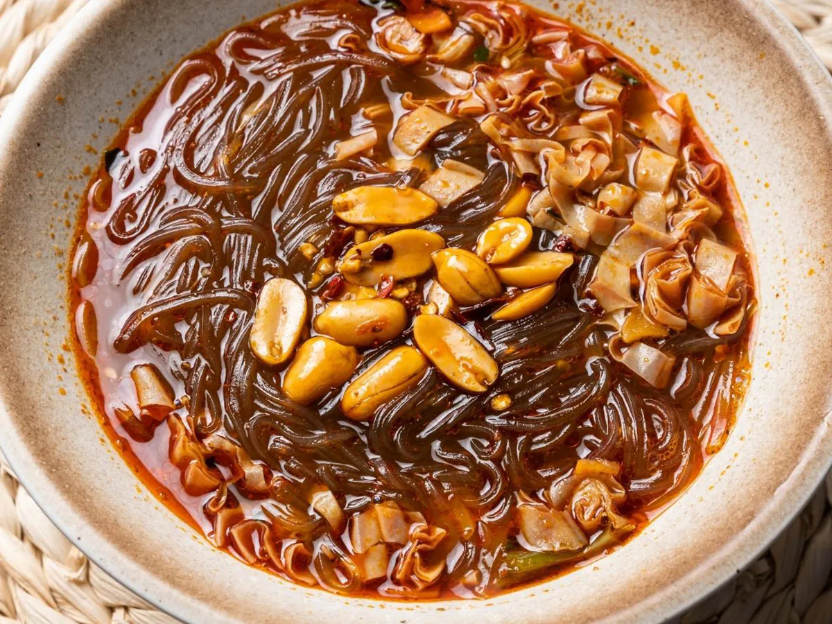 Spicy, tangy sweet potato noodles with peanuts & veggies at Dong bei Ren jia, a Asian Restaurant in Chicago