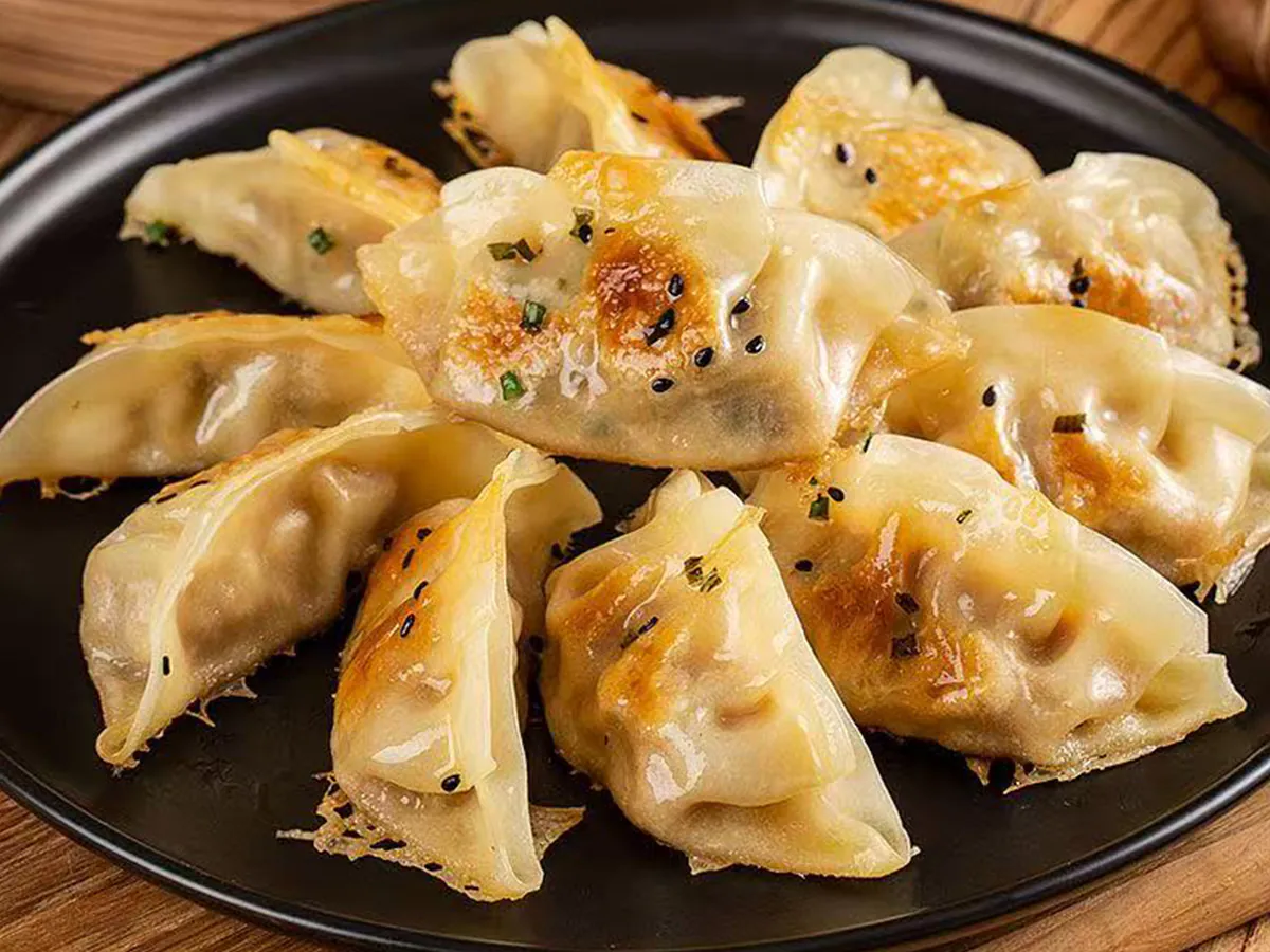Crispy pan-fried dumplings with savory filling at Dong bei Ren jia, a Asian Restaurant in Chicago